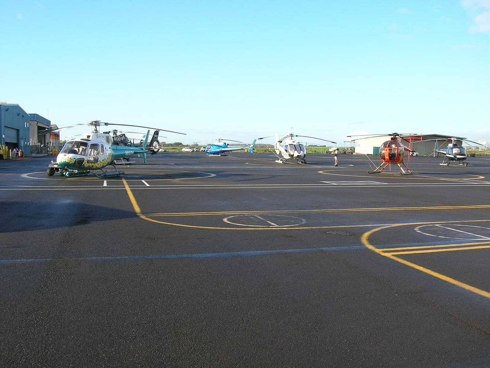 Tour helicopters lined up at the Kahului Heliport on Maui